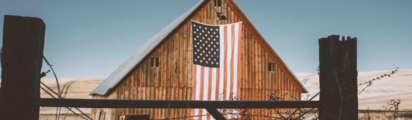 Barn with flag draped over it